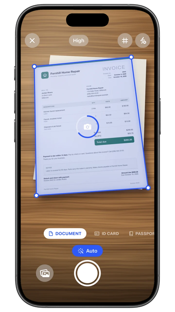 Filewise on iPhone scanning a paper invoice, with blue edges around the detected page